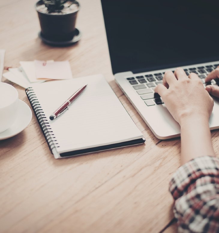 Marketer planning a campaign on a laptop